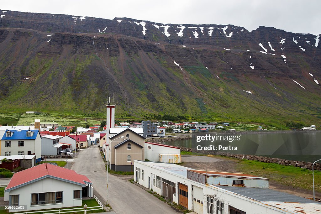 Houses and street against mountains