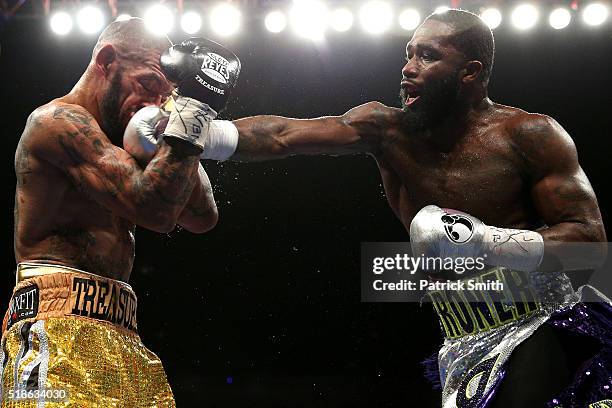 Ashley Theophane and Adrien Broner exchange punches in their super lightweight championship bout at the DC Armory on April 1, 2016 in Washington, DC.