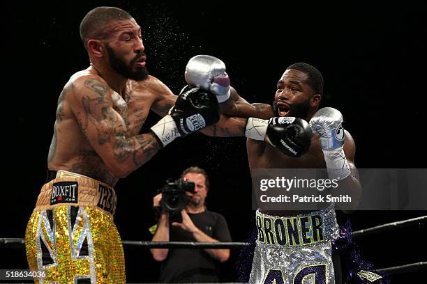 Ashley Theophane and Adrien Broner exchange punches in their super lightweight championship bout at the DC Armory on April 1, 2016 in Washington, DC.