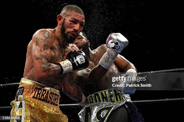 Ashley Theophane and Adrien Broner exchange punches in their super lightweight championship bout at the DC Armory on April 1, 2016 in Washington, DC.