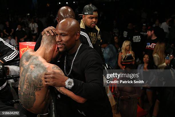 Ashley Theophane is consoled by Floyd Mayweather after being defeated by TKO in the ninth round by Adrien Broner in their super lightweight...