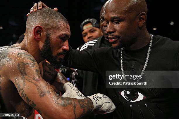 Ashley Theophane is consoled by Floyd Mayweather after being defeated by TKO in the ninth round by Adrien Broner in their super lightweight...