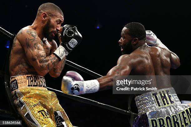 Ashley Theophane and Adrien Broner exchange punches in their super lightweight championship bout at the DC Armory on April 1, 2016 in Washington, DC.