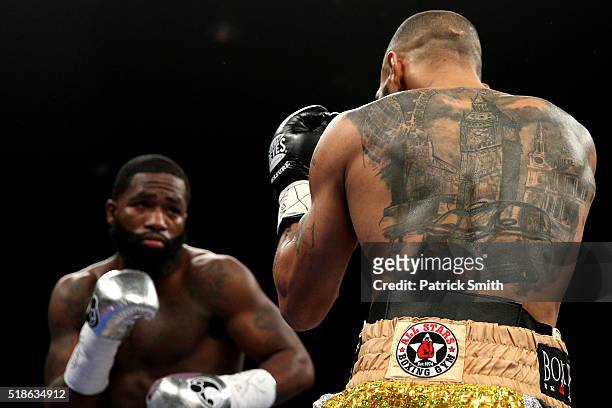 Ashley Theophane and Adrien Broner exchange punches in their super lightweight championship bout at the DC Armory on April 1, 2016 in Washington, DC.
