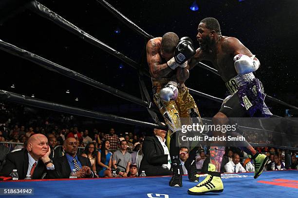 Ashley Theophane and Adrien Broner exchange punches in their super lightweight championship bout at the DC Armory on April 1, 2016 in Washington, DC.