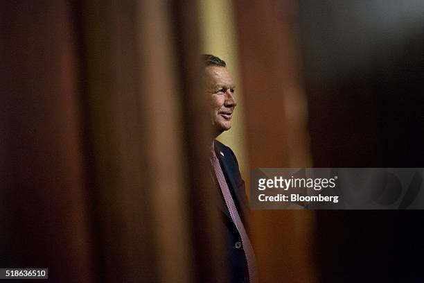John Kasich, governor of Ohio and 2016 Republican presidential candidate, stands outside a ballroom prior to speaking during the "Wisconsin Decides...