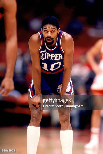 Norm Nixon of the San Diego Clippers rest on the court during a game in November, 1983.