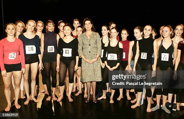 Princess Caroline of Hanover stands with students as she opens the Monaco Dance Forum December 15, 2004 in Monte Carlo, Monaco.