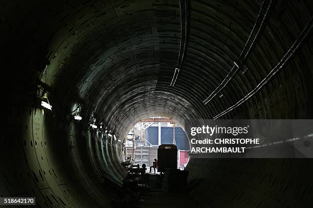 This picture taken on March 8, 2016 shows a worker sitting at an end of a tunnel under construction along the current extension of the Metropolitan...