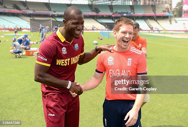 Darren Sammy of the West Indies and England captain Eoin Morgan share a joke ahead of tomorrrow's ICC World Twenty20 India 2016 Final between England...