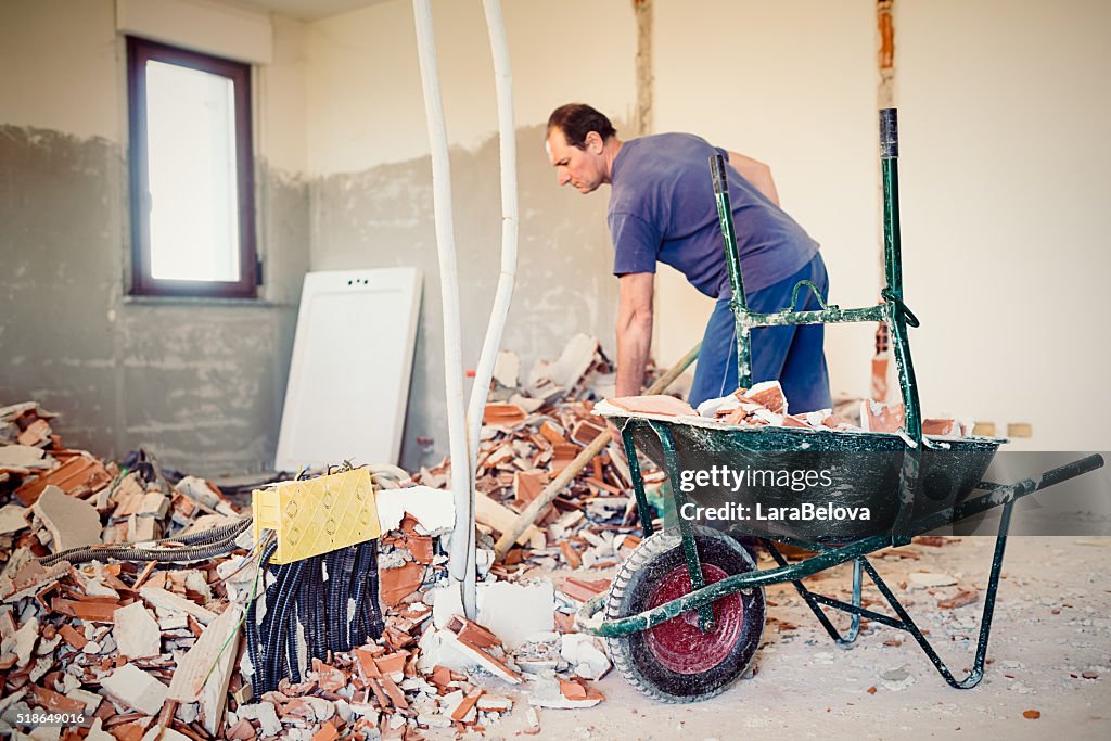 Real Italian worker repairing apartment