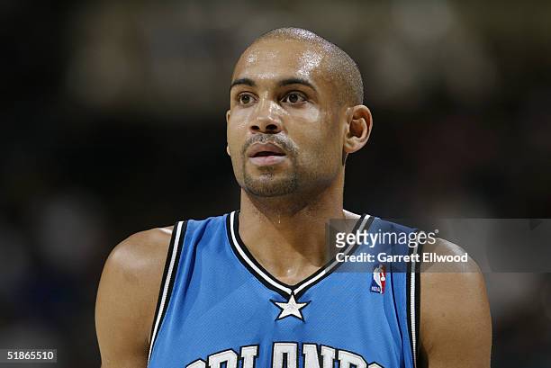 Grant Hill of the Orlando Magic watches the game against the Denver Nuggets on December 6, 2004 at Pepsi Center in Denver, Colorado. The Nuggets won...