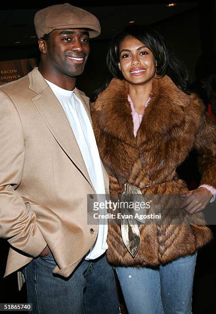 Curtis Martin of the New York Jets and model Shakara attend "The Woodsman" film premiere at The Skirball Center December 15, 2004 in New York City.