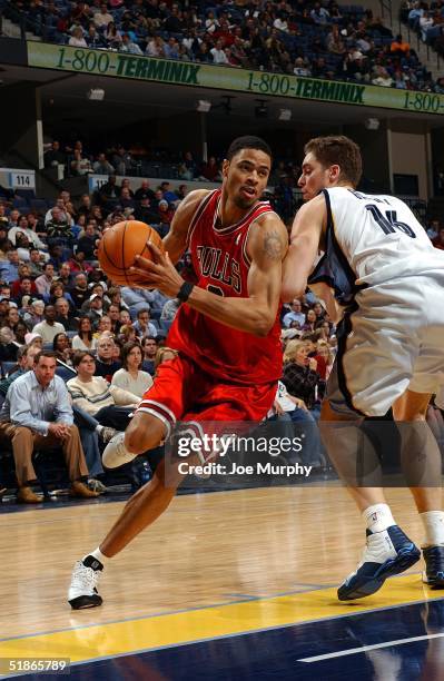 Tyson Chandler of the Chicago Bulls drives to the basket past the defense of Pau Gasol of the Memphis Grizzlies during a game at FedexForum on...