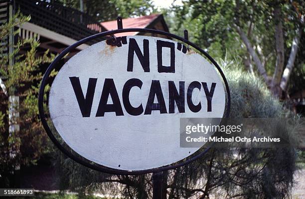 No Vacancy sign is hung outside a motel near Henderson, Nevada. Circa 1942.