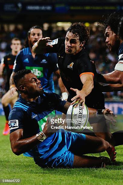 Lolagi Visinia of the Blues looks to offload the ball during the round 6 super rugby match between the Blues and the Jaguares at QBE Stadium on April...