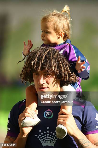 Kevin Proctor of the Storm and his daughter Zara celebrate the win during the round five NRL match between the Melbourne Storm and the Newcastle...