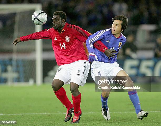 Germany's Gerald Asamoah controls the ball against Yasuhito Endo of Japan during the international friendly match between Germany and Japan at...