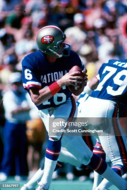 Quarterback Joe Montana of the San Francisco 49ers looks to pass in a 16 to 13 AFC win at the Pro Bowl on .