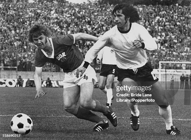 Konrad Weise of East Germany and Gerd Müller of West Germany in action during the World Cup Group 1 match at the Volksparkstadion, Hamburg, Germany,...