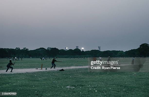 Locals play cricket on the Maidan at sunset ahead of the ICC World Twenty20 India Final between England and West Indies at Eden Gardens on April 2,...