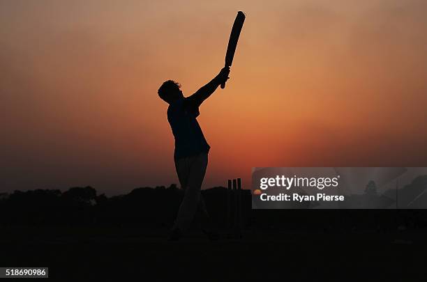 Locals play cricket on the Maidan at sunset ahead of the ICC World Twenty20 India Final between England and West Indies at Eden Gardens on April 2,...