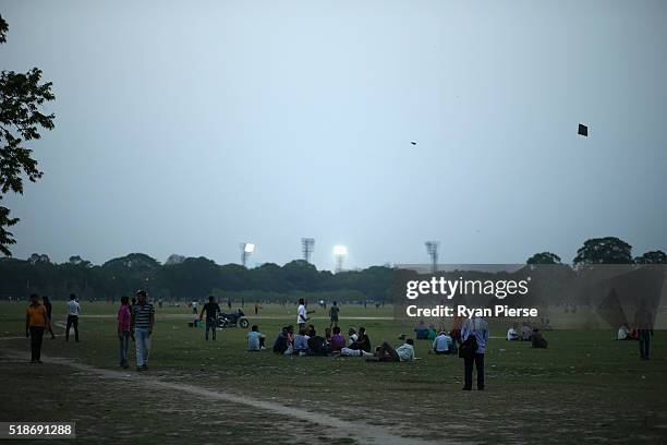 Locals gather on the Maidan at dusk ahead of the ICC World Twenty20 India Final between England and West Indies at Eden Gardens on April 2, 2016 in...