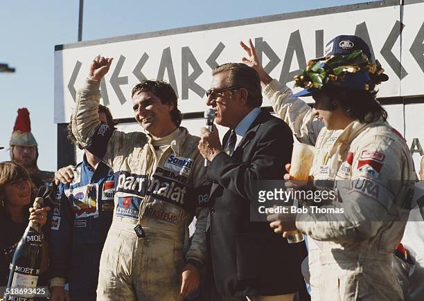 Jean Marie Balestre, president of the FIA on the podium with race winner Nelson Piquet, second placed Alain Prost and third placed Bruno Giacomelli...