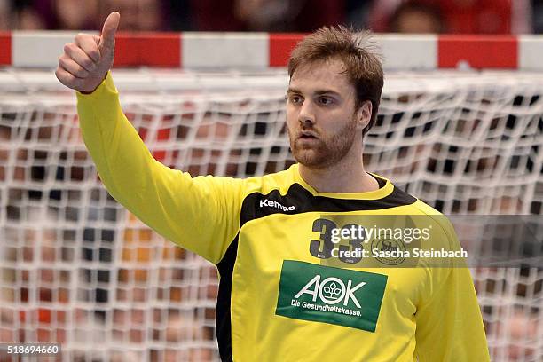 Goalkeeper Andreas Wolff of Germany reacts during the Handball international friendly match between Germany and Denmark at Lanxess Arena on April 2,...