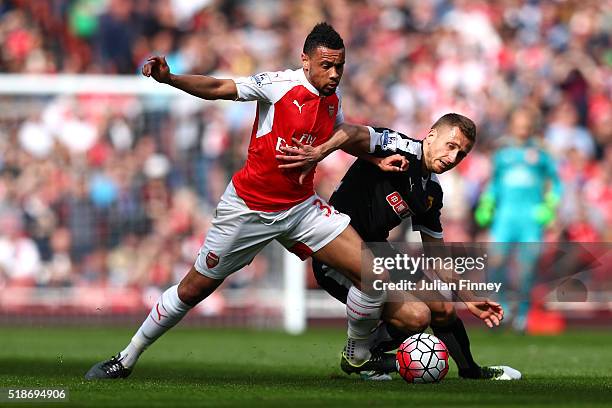 Francis Coquelin of Arsenal and Almen Abdi of Watford compete for the ball during the Barclays Premier League match between Arsenal and Watford at...