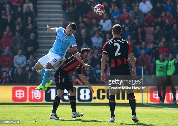 Sergio Aguero of Manchester City heads the ball to score his team's third goal during the Barclays Premier League match between A.F.C. Bournemouth...