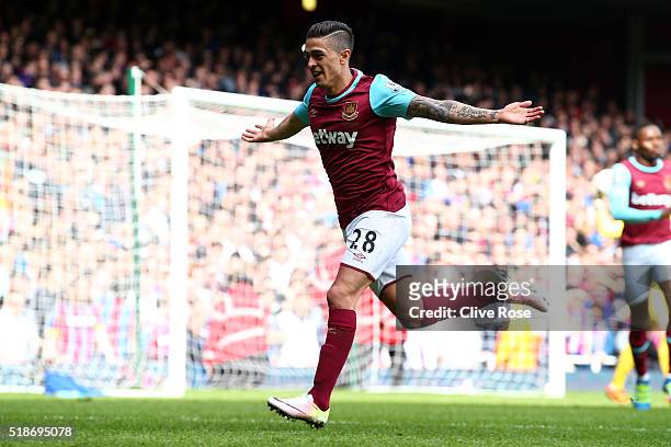 Manuel Lanzini of West Ham United celebrates scoring his team's first goal during the Barclays Premier League match between West Ham United and...