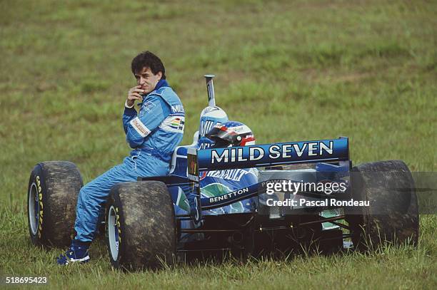 Jean Alesi of France sits beside his Mild Seven Benetton Renault Benetton B196 Renault V10 during practice for the Brazilian Grand Prix on 30th March...