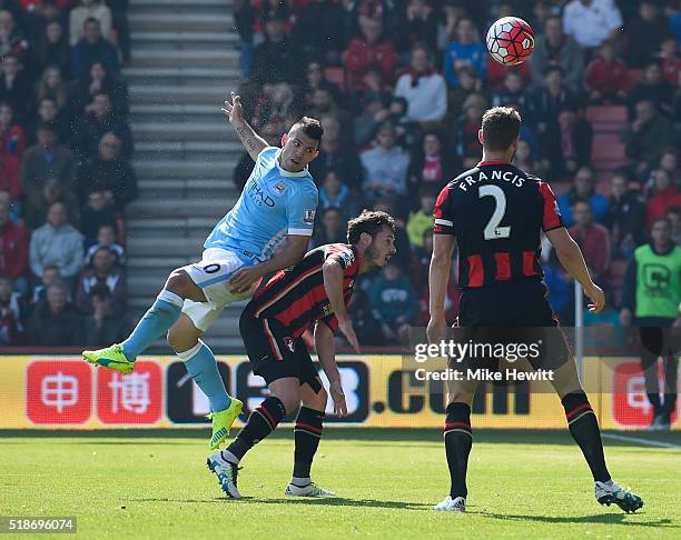 Sergio Aguero of Manchester City heads the ball to score his team's third goal during the Barclays Premier League match between A.F.C. Bournemouth...