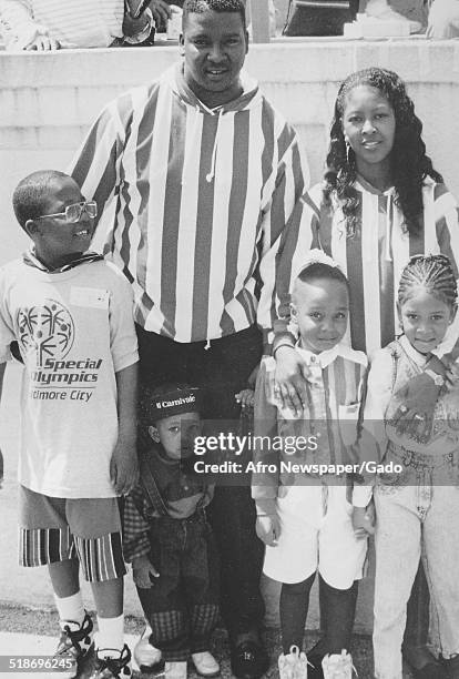 Parents and child during the Special Olympics, 1995.