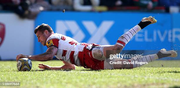 Henry Trinder of Gloucester dives over for their second try during the Aviva Premiership match between Leicester Tigers and Gloucester at Welford...