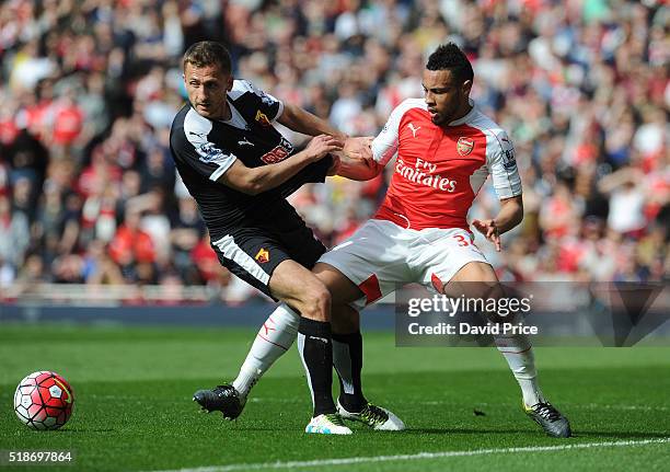 Francis Coquelin of Arsenal is challenged by Almen Abdi of Watford during the Barclays Premier League match between Arsenal and Watford at Emirates...