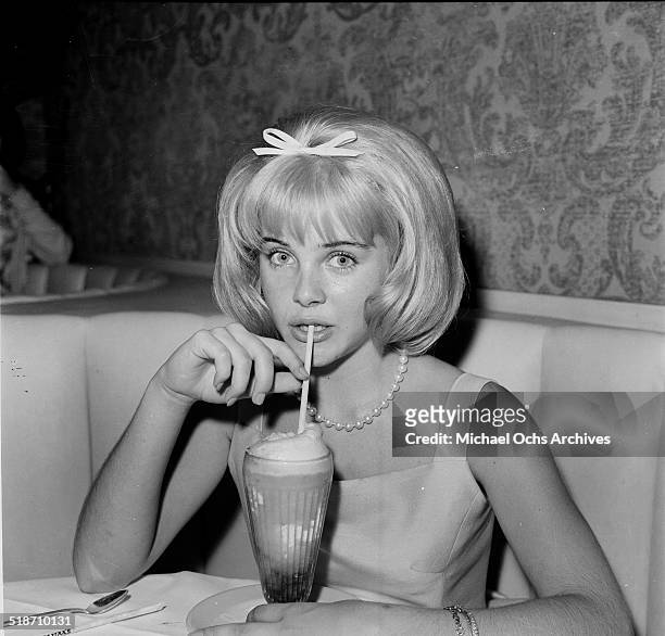 Sue Lyon sips a milkshake after the movie premiere of "Lolita" at sandpipers in Los Angeles,CA.