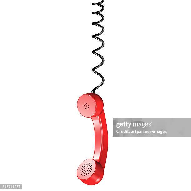 red phone receiver on a spiral cord on white - phone receiver stock pictures, royalty-free photos & images