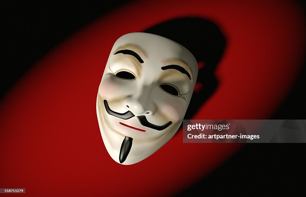 Mask of Guy Fawkes on red