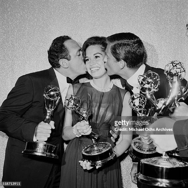 Mary Tyler Moore is kissed by co-stars after receiving the Emmy Award for "The Dick Van Dyke Show" in Los Angeles,CA.