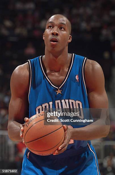 Dwight Howard of the Orlando Magic shoots a free throw during the game with the Atlanta Hawks on November 26, 2004 at Philips Arena in Atlanta,...