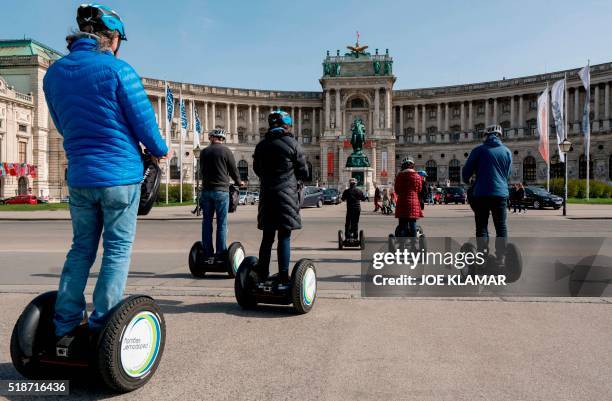 Tourists ride their segway boards in front of the Hofburg Palace as they explore Vienna, Austria on April 2, 2016.