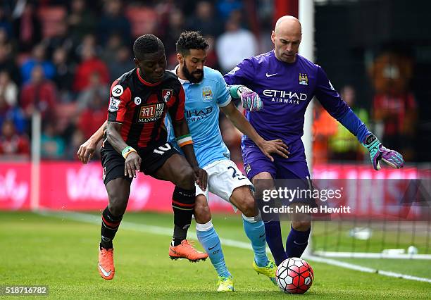 Max Gradel of Bournemouth competes for the ball against Gael Clichy and Wilfredo Caballero of Manchester City during the Barclays Premier League...