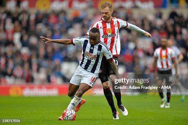 Jan Kirchhoff of Sunderland and Saido Berahino of West Bromwich Albion battle for the ball during the Barclays Premier League match between...