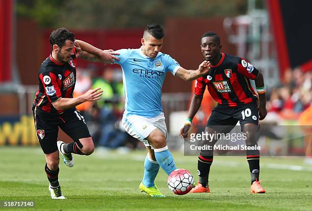 Sergio Aguero of Manchester City competes for the ball against Adam Smith and Max Gradel of Bournemouth during the Barclays Premier League match...