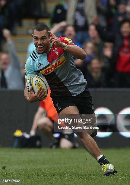 Joe Marchant of Harlequins celebrates scoring a try during the Aviva Premiership match between Harlequins and Newcastle Falcons at Twickenham Stoop...