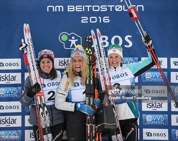 Winner Therese Johaug , Heidi Weng , Ingvild Flugstad Oestberg celebrate victory at Cross Country Ladies 30 km Free on April 02, 2016 in...