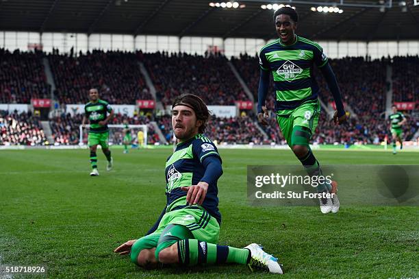Alberto Paloschi of Swansea City celebrates scoring his team's second goal with his team mate Leroy Fer during the Barclays Premier League match...