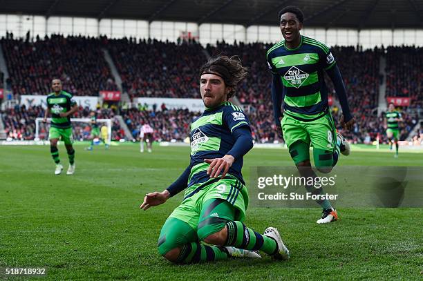 Alberto Paloschi of Swansea City celebrates scoring his team's second goal with his team mate Leroy Fer during the Barclays Premier League match...